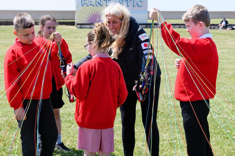 Sacha Dench shows pupils from Ryelands Primary School how her paramotor works. Photo: Kelvin Stuttard