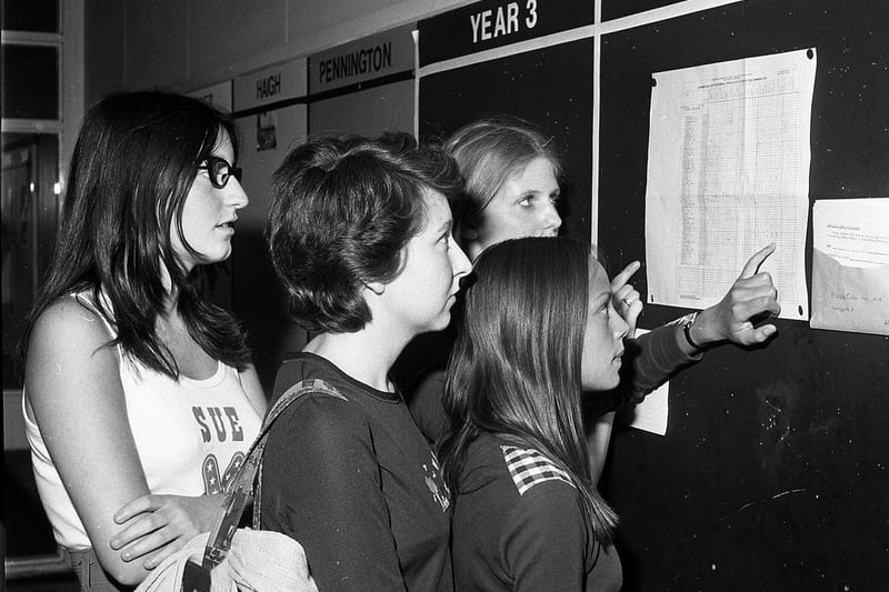 Whitley High School students eagerly scan their exam results in 1976