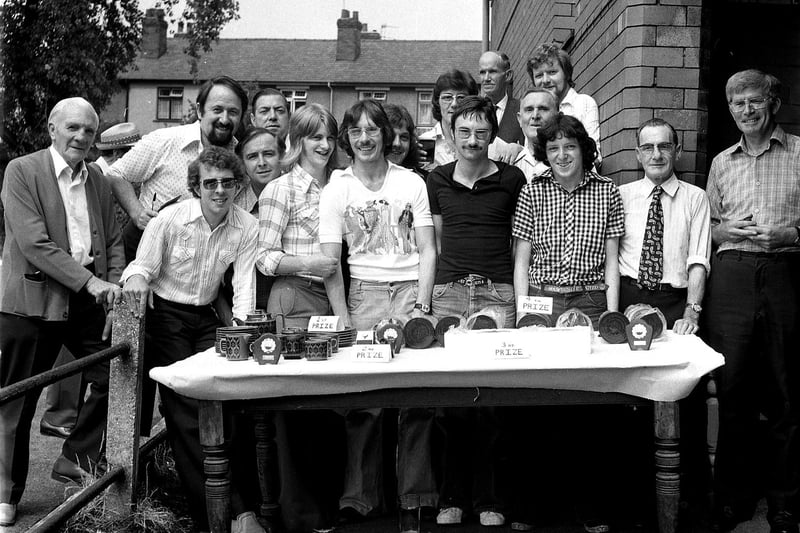 Crown green bowlers line up at The  Pagefield Hotel with their trophies and prizes in 1976