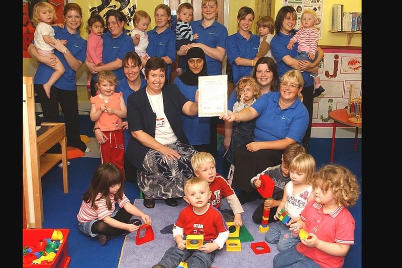 Sure Start award for First Steps Nursery on Upper Warrengate in 2004.. L to R Christine Smith of Sure Start presents certificate to Gillian Price manager of First Steps Nursery.