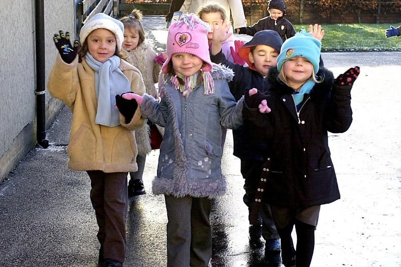 In 2005, Snapethorpe Primary School Nursery pupils held a sponsored walk to raise funds for the new nursery building. Pupils Lucianna, Chloe and Jessica lead the way.