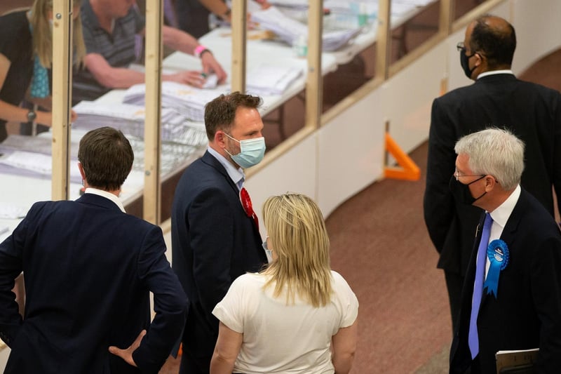 Labour and Conservative team members at the Batley and Spen by-election count