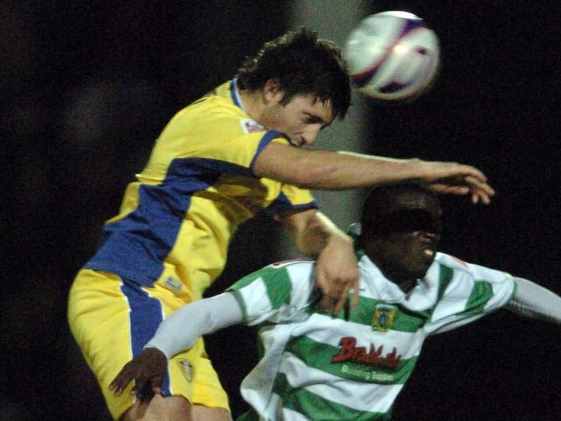 Alan Sheehan out jumps Yeovil Town's Marvin Williams.