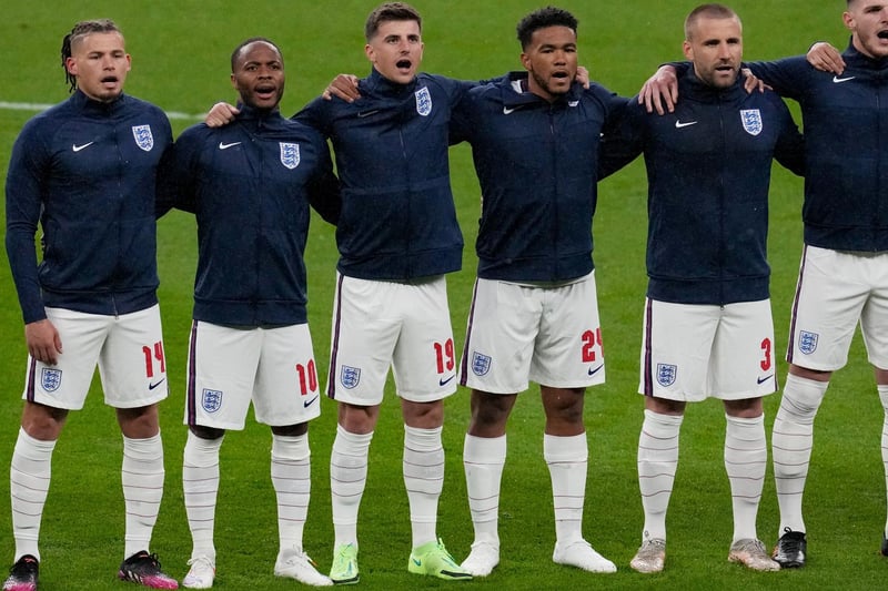 Phillips, left, lines up for the national anthem before England's second group stages game against Scotland at Wembley.