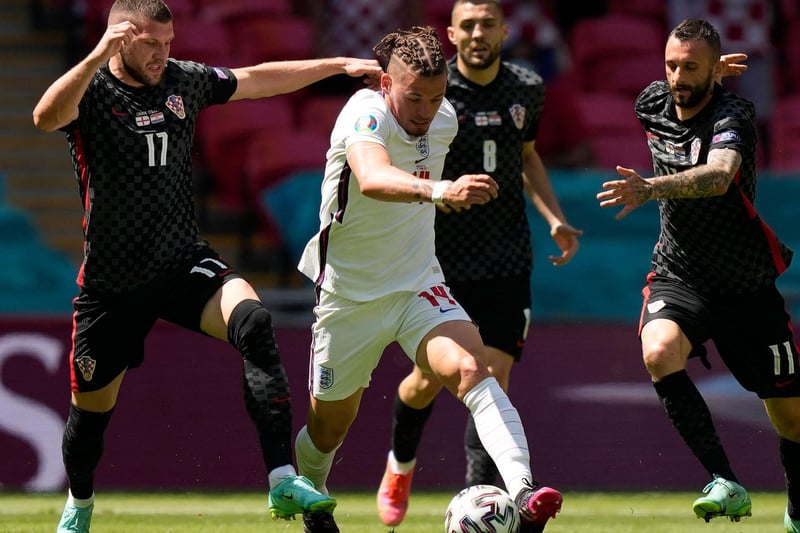 An image that sums up Phillips' man of the match display against Croatia as the Whites midfielder powers on with Ante Rebic, left, and Marcelo Brozovic, right, left trailing in his wake.