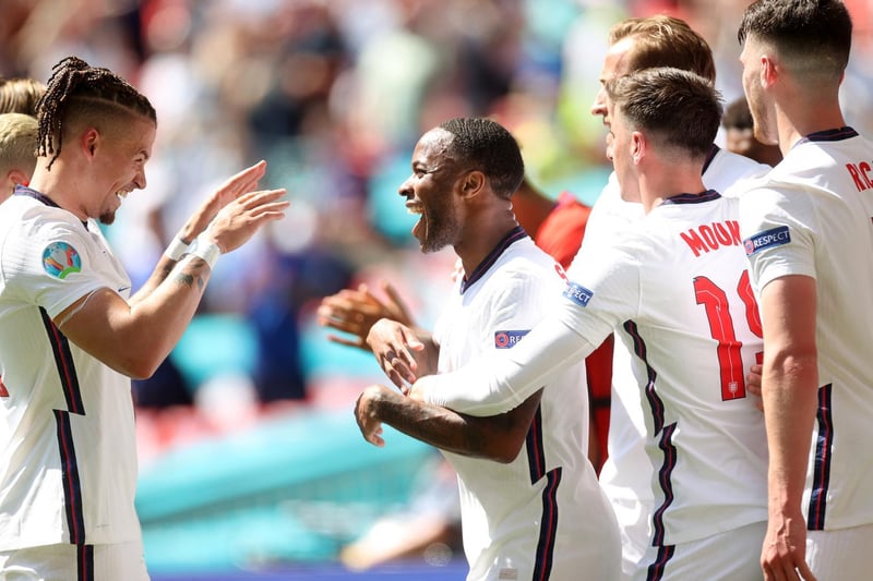 Phillips, left, celebrates setting up the only goal of the game for match-winner Raheem Sterling, centre, against Croatia.