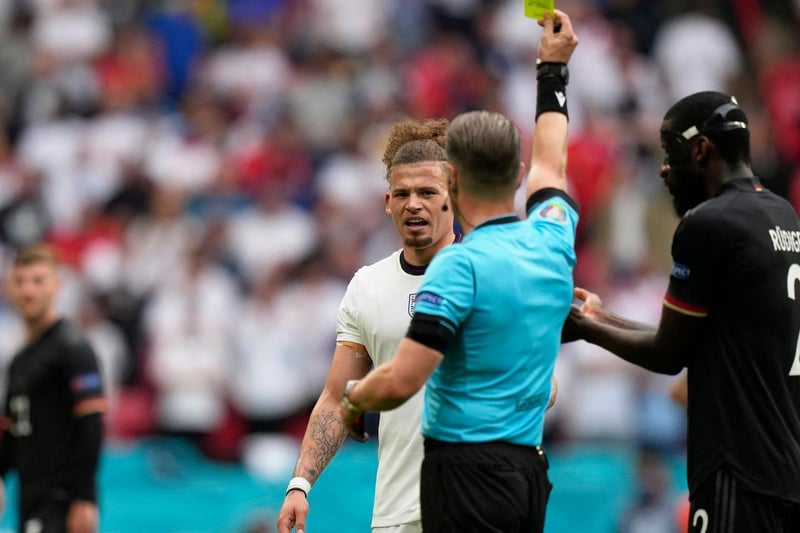 Phillips is booked during England's tense last 16 clash against Germany at Wembley following his cruncher on Toni Kroos.