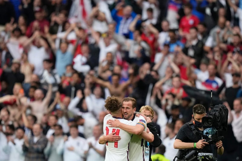 Phillips hugs captain and goalscorer Harry Kane in front of ecstatic England fans in the Wembley stands following the 2-0 victory against Germany which booked a quarter-final against Ukraine in Rome.