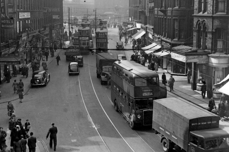 Boar Lane towards the city centre in April 1951. The Griffin Hotel and Jacomellis restuarant opposite are clearly seen.