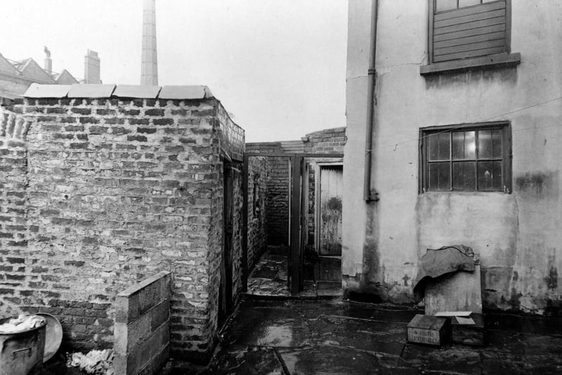 Derelict toulets at rear of properties on Vicar Lane in August 1951.