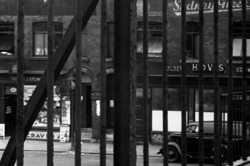Bridge Street through the railings of New York Road flyover in June 1951. Premises of Sydney Green wholesale clothing manufacturer can be seen.