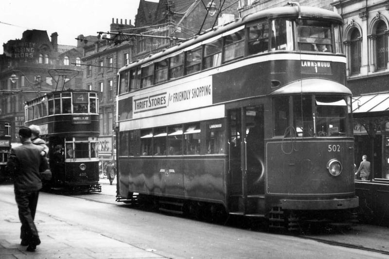 Briggate in June 1951 showing a line of trams, including ex-London Feltham no.502 in front, bound for Lawnswood on route no.1. The junction with Boar Lane is in the background on the left.