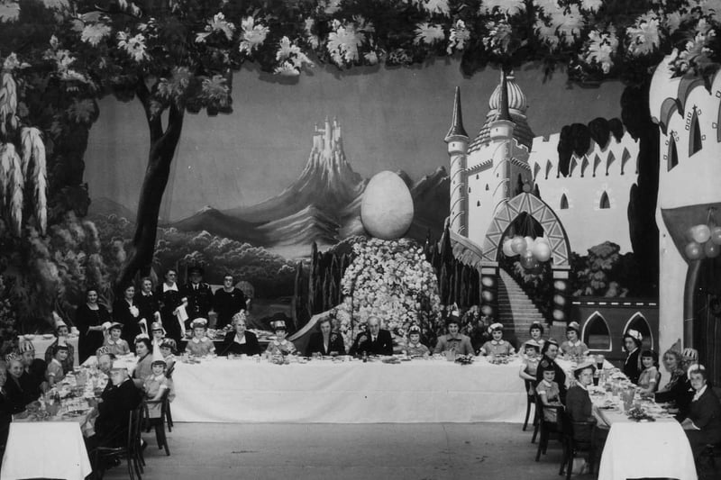 A tea party given by Francis Laidler at the Theatre Royal in March 1951 for the youngsters playing the 'Twelve Little Sunbeams' in his production of Humpty Dumpty. Each Sunbeam was given a present and a bouquet.