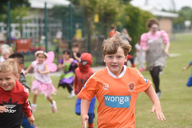 One young Seasiders fan races to the finish during Moor Park's fun run.