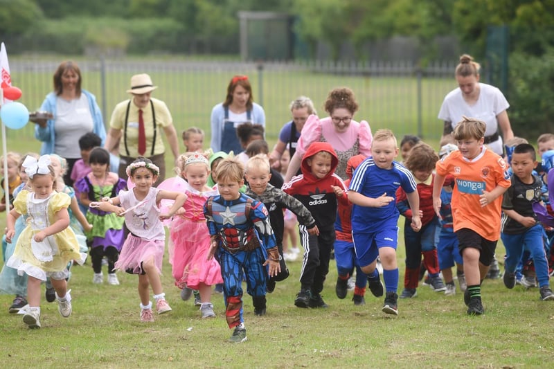 Pupils donned their best fancy dress to raise money in memory of teaching assistant Cath Strangwood.