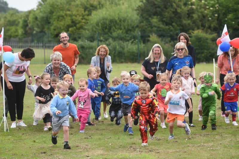 A flying start for some of the youngest children during Moor Park's fun run.