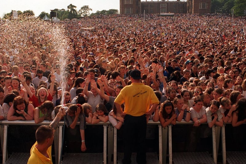 July 1996 and the weather was so warm that revellers were cooled down by hosepipe.