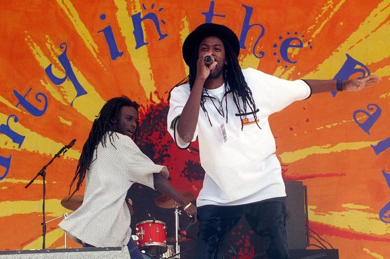 Reggae group Azwad belt out a tune on stage in July 1999.  The band's UK hit singles include the number one Don't Turn Around and Shine.