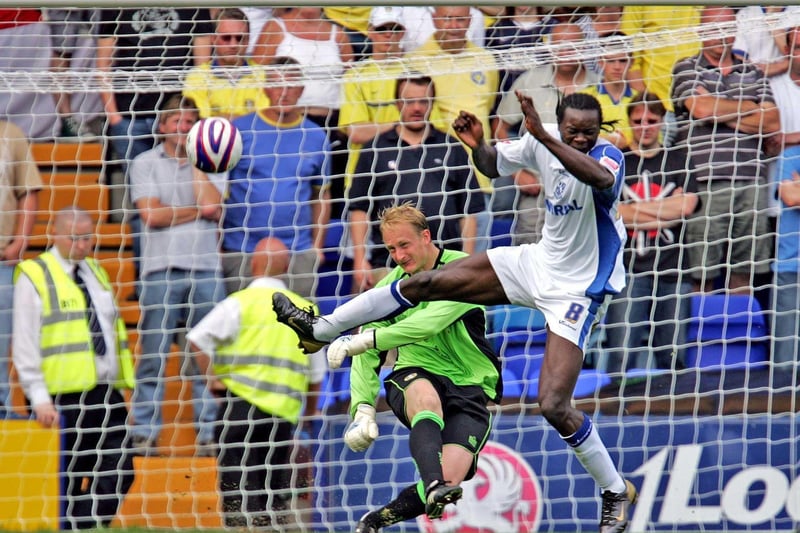 Casper Ankergren clears the ball whilst under pressure from Tranmere's Calvin Zola.