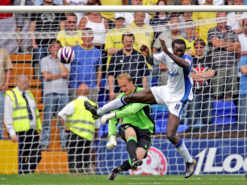 Casper Ankergren clears the ball whilst under pressure from Tranmere's Calvin Zola.