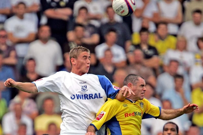 Andy Hughes challenges Tranmere's Steve Davies for a high ball.