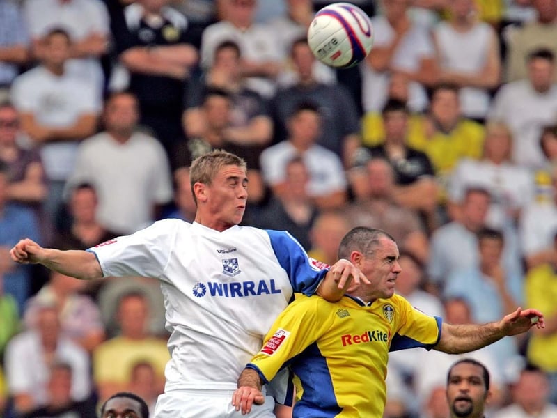 Andy Hughes challenges Tranmere's Steve Davies for a high ball.