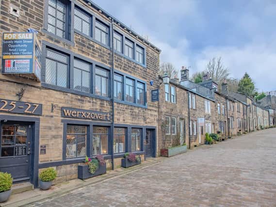 This property on the lower end of Haworth's Main Street was once two homes, which is how the Bronte family would have remembered it. It is now a gallery with studio and tearoom with living quarers across the first and second floors.
