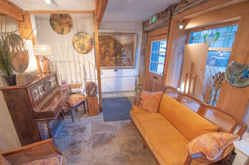 The entrance to the property doubles as a music room and sitting area