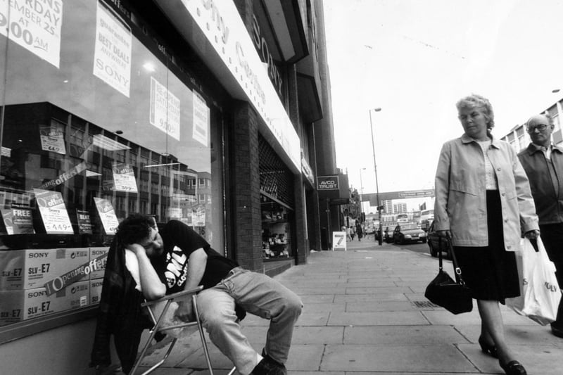 David Kelly sleeps out on the pavement on Vicar Lane in the city centre in September 1993 so as to be the first in line for the opening of the largest Sony Centre in Britain.