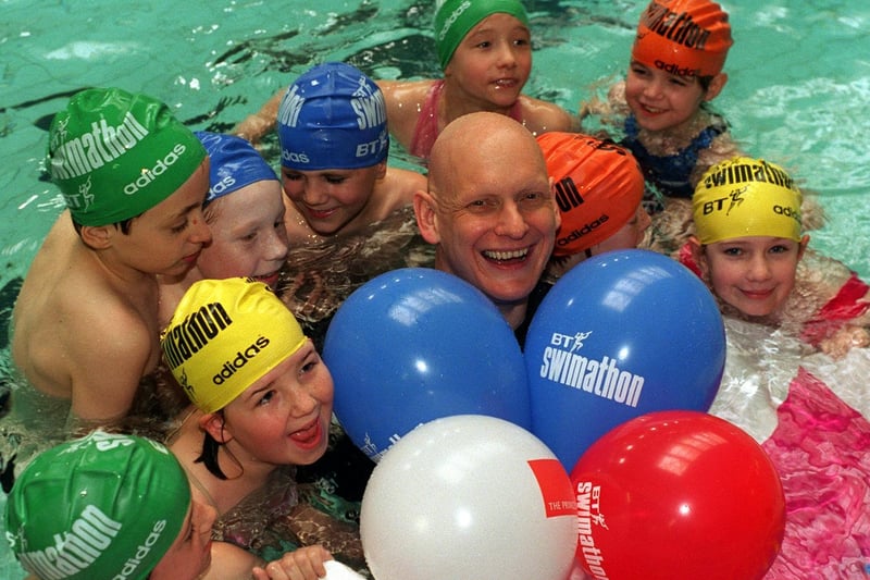 Pupils from Ryecroft Primary join Olympic swimmer Duncan Goodhew in March 1997 to launch the BT Swimathon '97 event at Armley Sport and Leisure Centre.