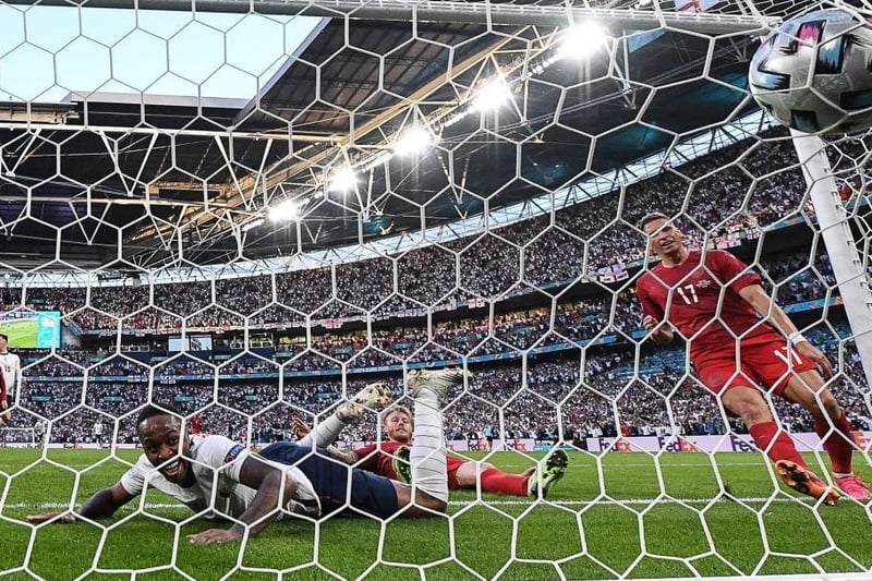 England's forward Raheem Sterling (C) scores his team's first goal during the UEFA EURO 2020 semi-final