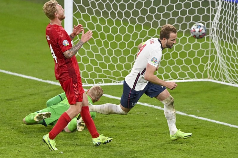 England's Harry Kane, right, reacts after scoring his team's second goal during the Euro 2020 soccer championship semifinal (Justin Tallis/Pool Photo via AP)