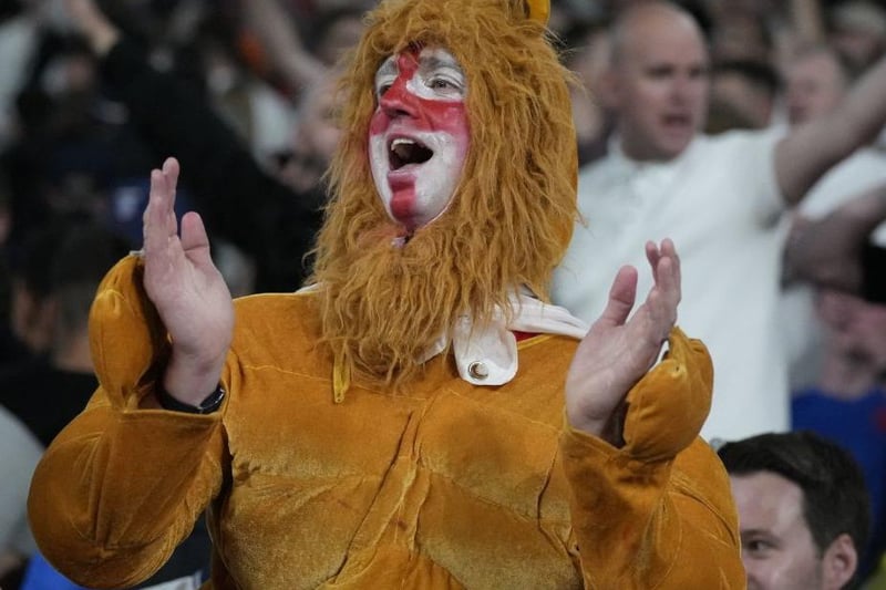 An England supporter dressed as a lion celebrates at the end of the UEFA EURO 2020 semi-final