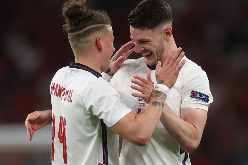 With fellow midfield maestro Declan Rice. Photo by CARL RECINE/POOL/AFP via Getty Images.