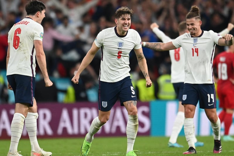 With Harry Maguire, left, and John Stones, middle, at the full time whistle. Photo by ANDY RAIN/POOL/AFP via Getty Images.