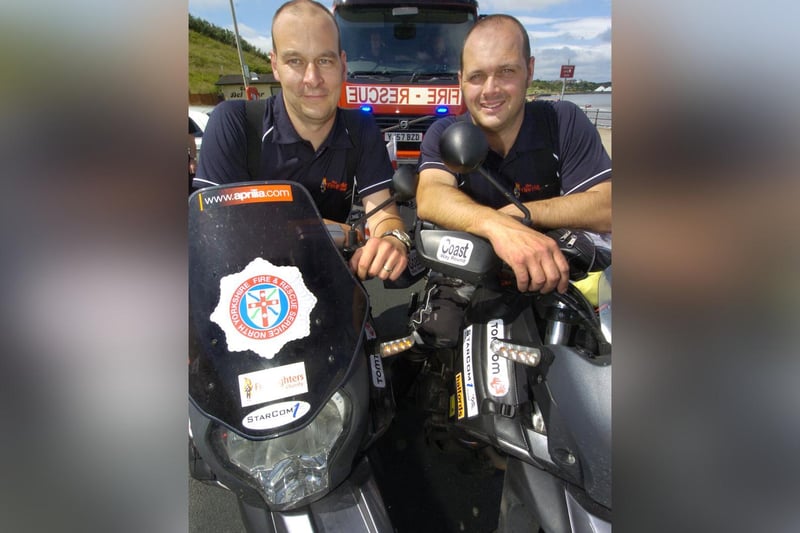 Firefighters Andy Creasey, left, and Stuart Hopkin complete their fundraising bike ride.