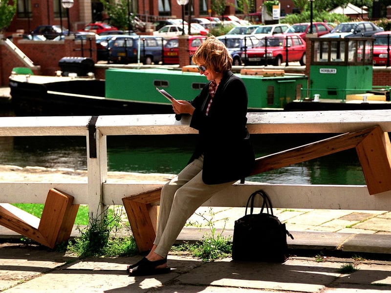 A member of the public manages to get comfortable on the 'unsittable seat' on the canalside at Granary Wharf.
