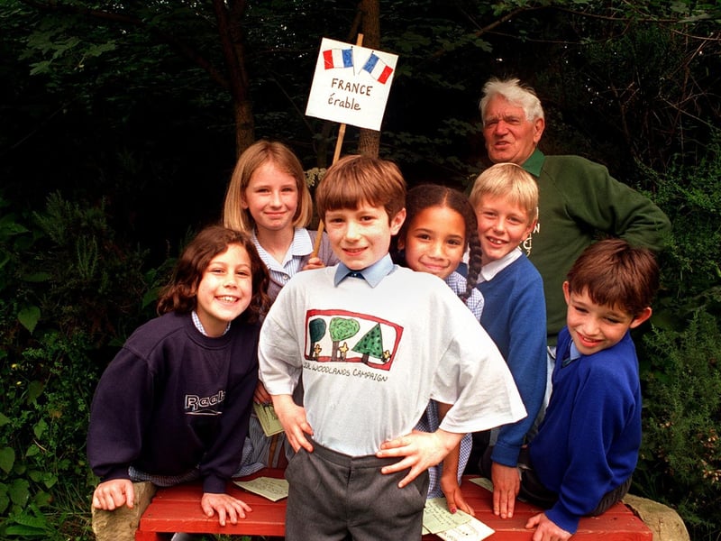 David Ellis and classmates from Wigton Moor Primary cut a green ribbon to open the Ten Tree Trail at Hollybush Nature Garden. He was the winner of a competition to design a logo for the BTCV Local Woodlands Campaign