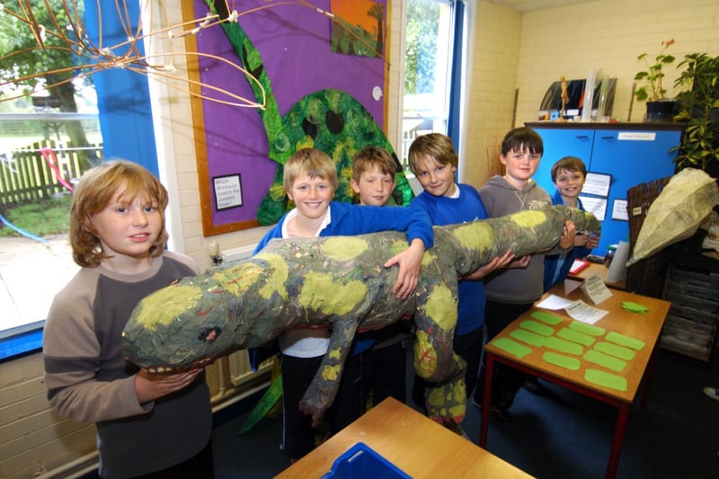 Lythe Primary School pupils are pictured with a huge dinosaur they made.