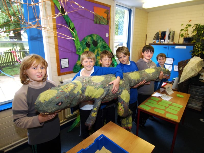 Lythe Primary School pupils are pictured with a huge dinosaur they made.