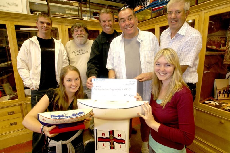 Smiles all round at a lifeboat cheque presentation.