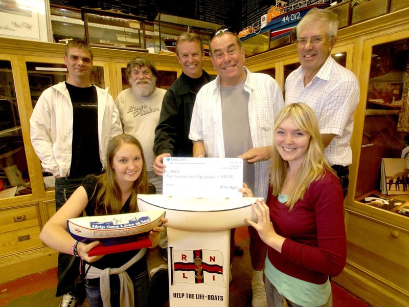 Smiles all round at a lifeboat cheque presentation.