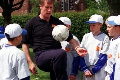 England's 1966 World Cup striker Geoff Hurst during a training session with children at St John's Junior and Infant School in Wakefield.
