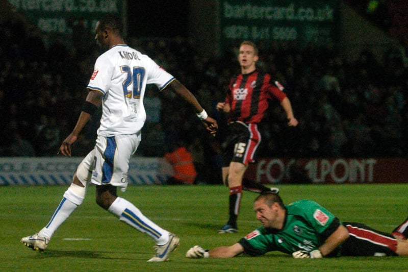 Tresor Kandol goes past Bournemouth goalkeeper Neil Moss to score at Dean Court in November 2007.