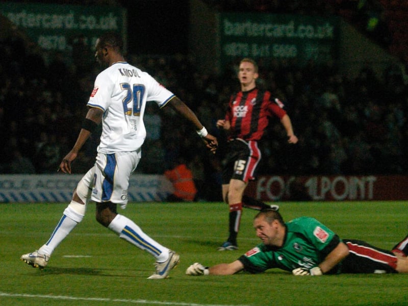 Tresor Kandol goes past Bournemouth goalkeeper Neil Moss to score at Dean Court in November 2007.