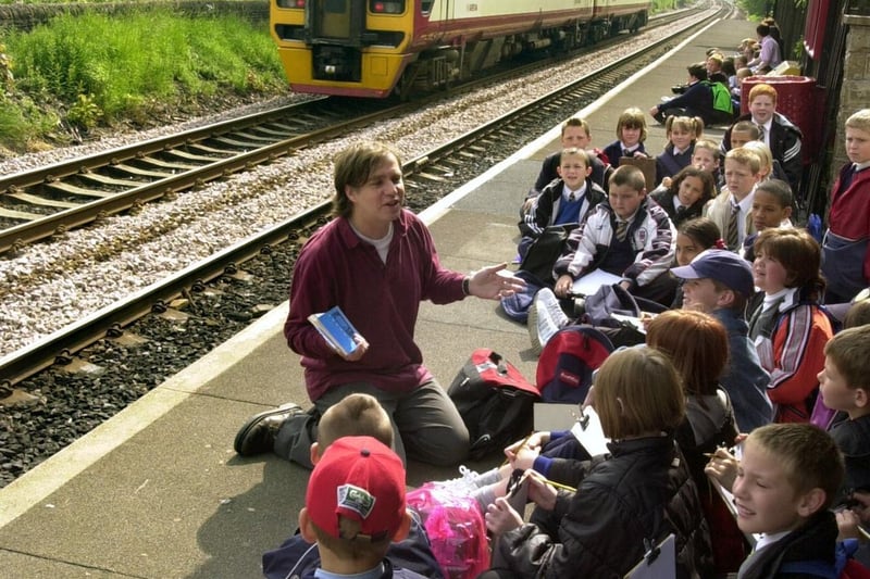 Poet Peter Sanson is pictured with pupils of Sandford Primary School before boarding the train at Bramley Station in June 2001.