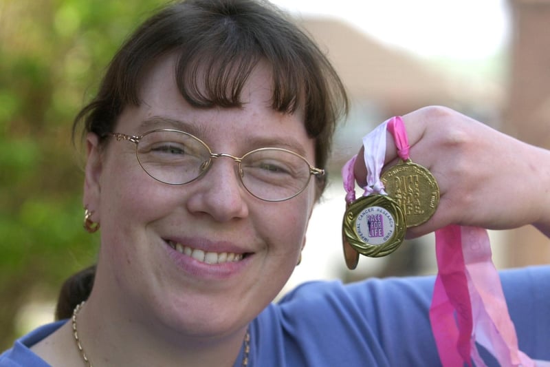 This is Bramley's Lisa Marsh who was taking part in the Race for Life event in May 2001. She is pictured with some of her medals from previous races.