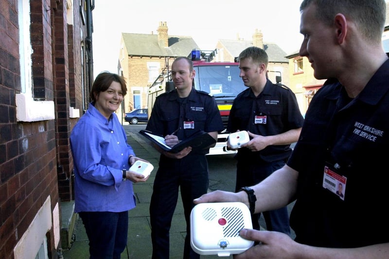 Firefighters from Bramley Fire Station were handin out free fire alarms to residents in South End Grove. Pictured is resident Lynn Ward-Smith with sub-officer Gary Asquith, firefighter Steve Blore and firefighter Gavin Hampson.
