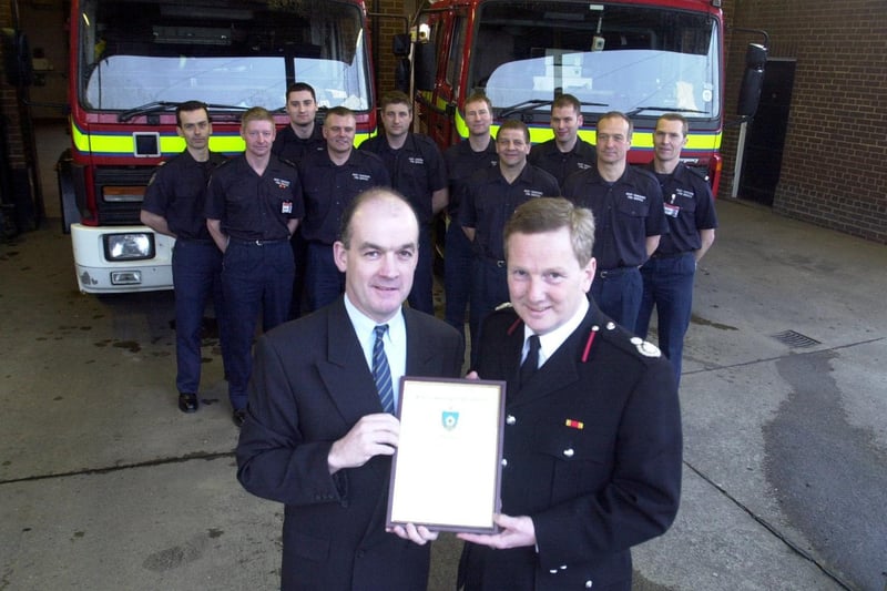 Billy Halligan (left) was presented with a Chief Fire Officer's Commendation by Assistant Chief Fire Officers Allan Hughes after he saved the life of Barley Corn pub landlady Susan Hanlon.