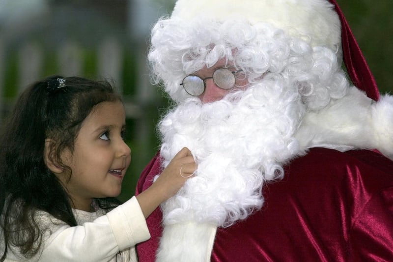 Simran Singh meets Santa during a Christmas party held at  Fairfield Community Centre in December 2001.